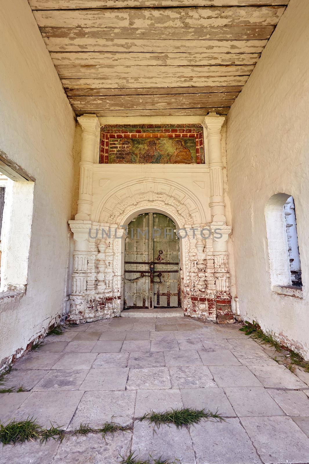 Locked wooden door of the old orthodox church. Closed door