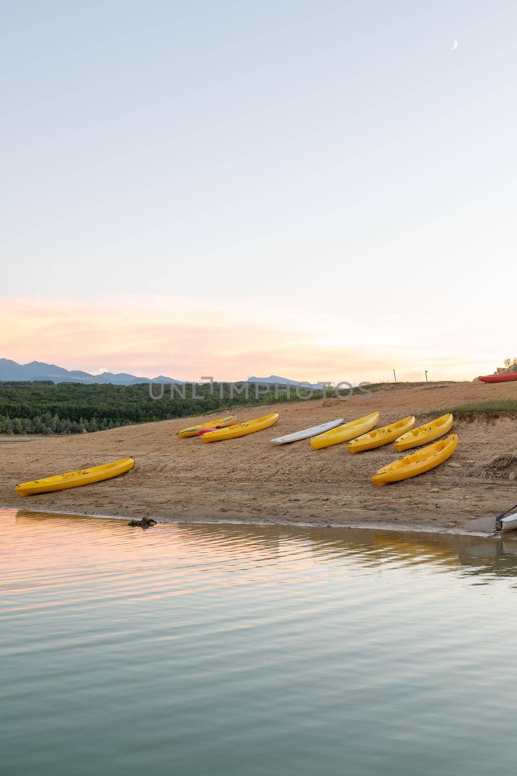 Sunset on Lake Montbel in Ariege with the boats in the summer of 2022 by martinscphoto