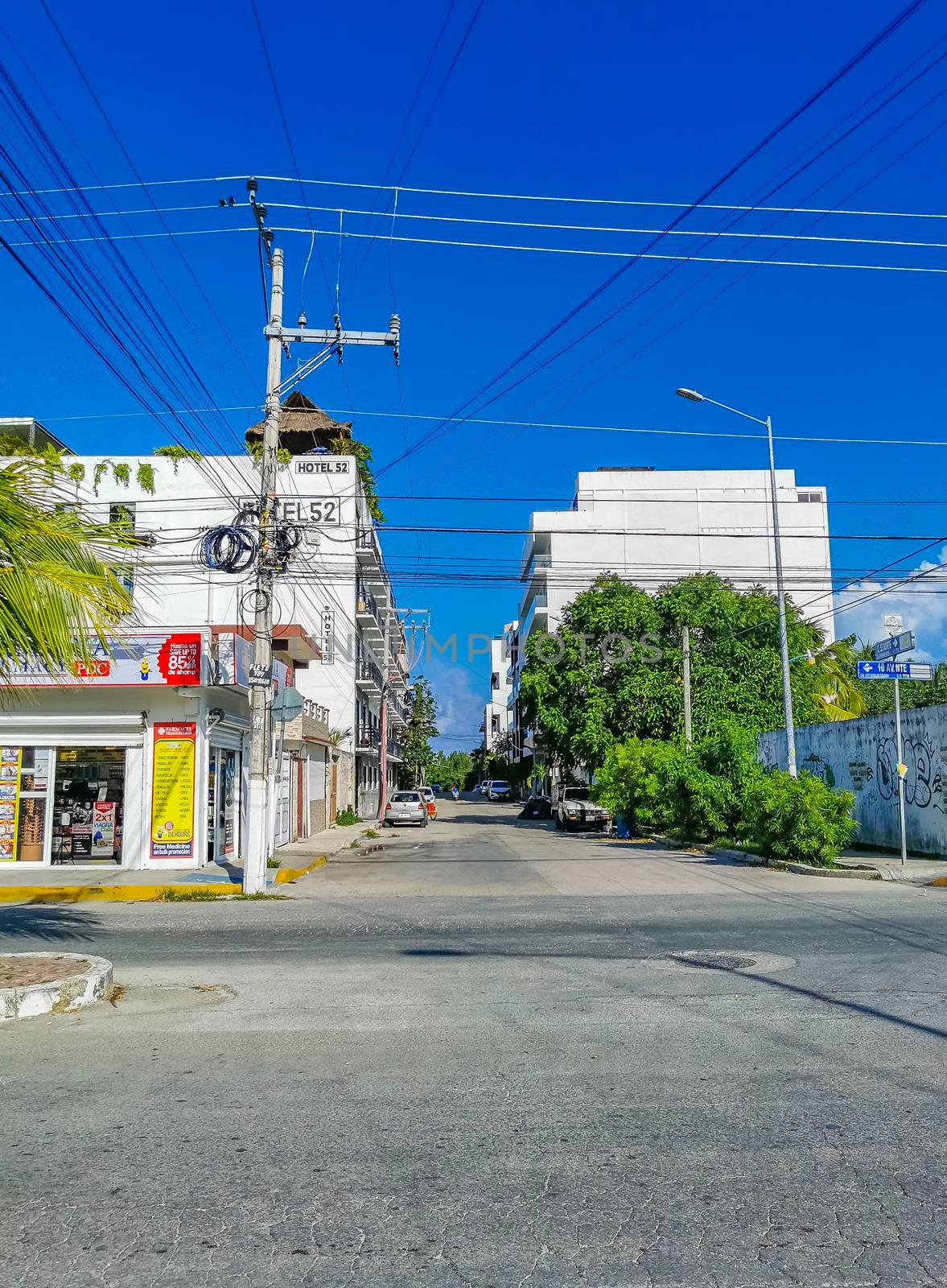 Playa del Carmen Mexico 04. July 2022 Typical street road and cityscape with cars and buildings of Luis Donaldo Colosio Playa del Carmen in Mexico.