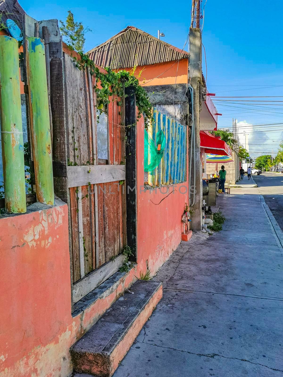 Playa del Carmen Mexico 04. July 2022 Typical street road and cityscape with cars and buildings of Luis Donaldo Colosio Playa del Carmen in Mexico.