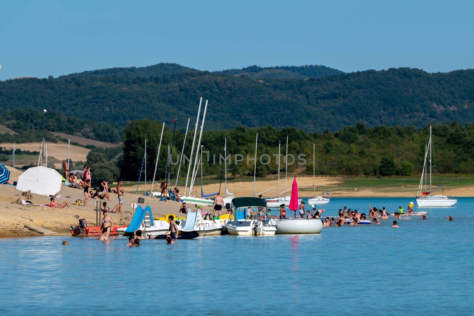 Montbel, France. 2022 August 2 . Sunset on Lake Montbel in Ariege with the boats in the summer of 2022.