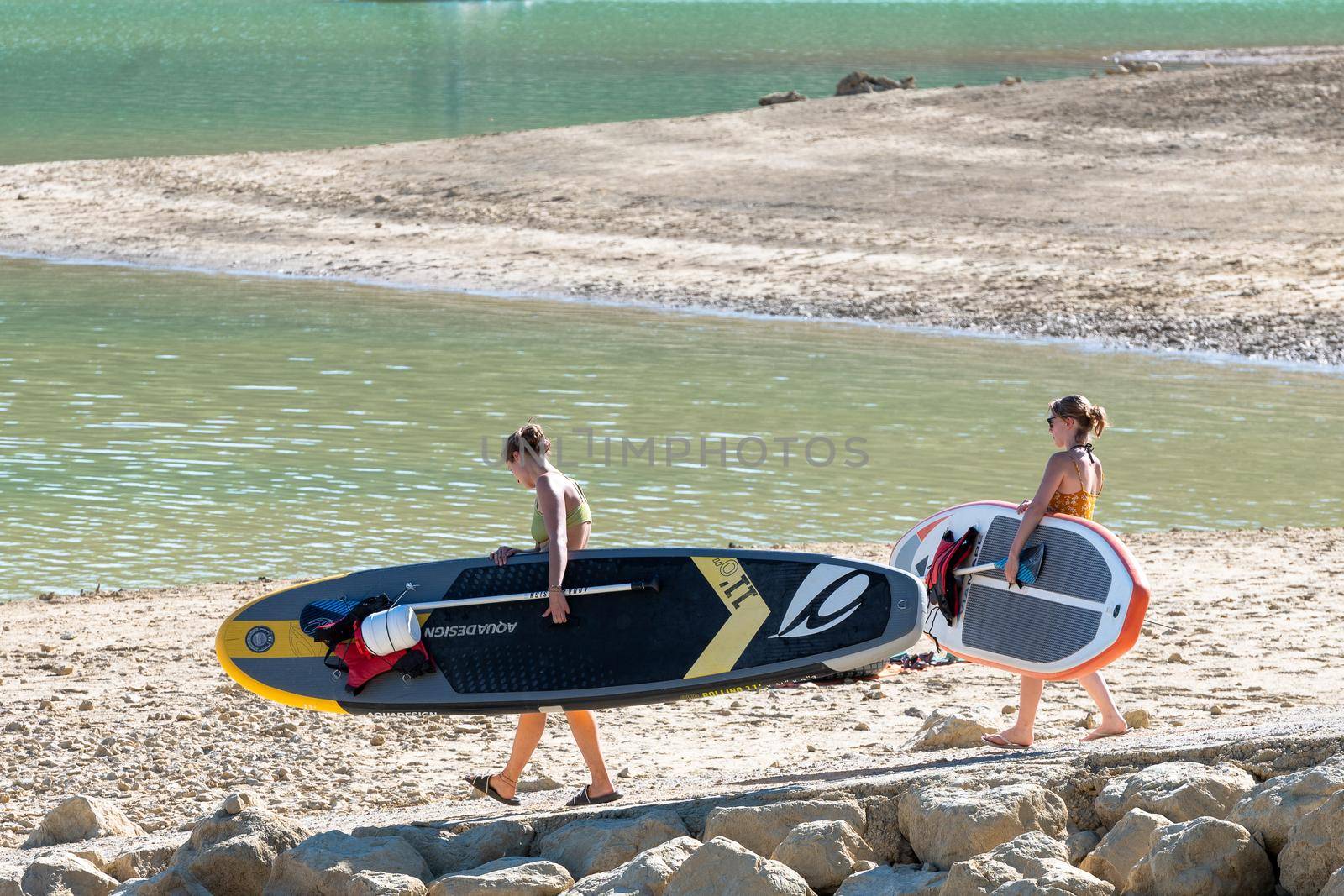 Montbel, France. 2022 August 2 . People practicing water sports on Lake Montbel in Ariege with the boats in the summer of 2022.