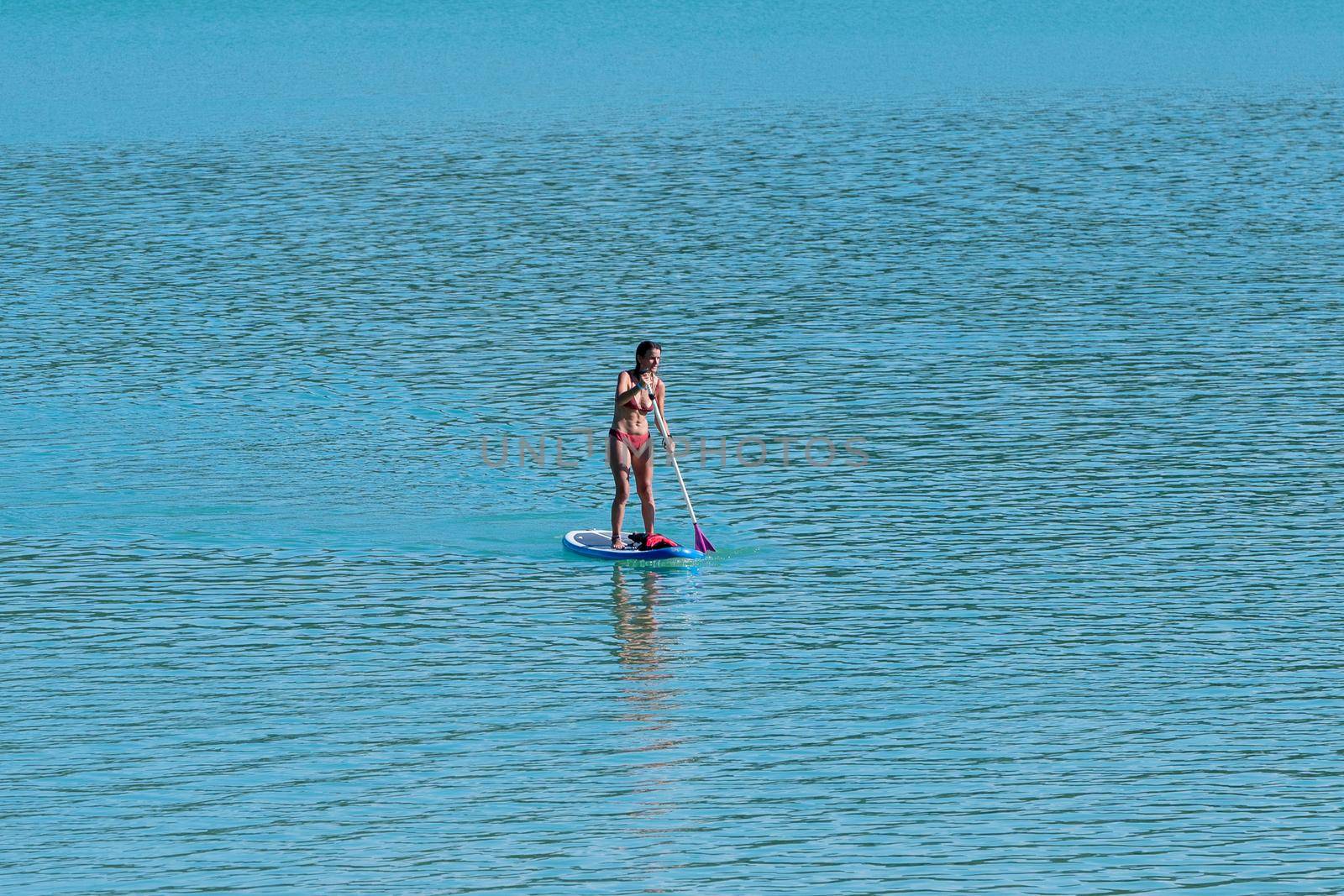 Montbel, France. 2022 August 2 . People practicing water sports on Lake Montbel in Ariege with the boats in the summer of 2022.