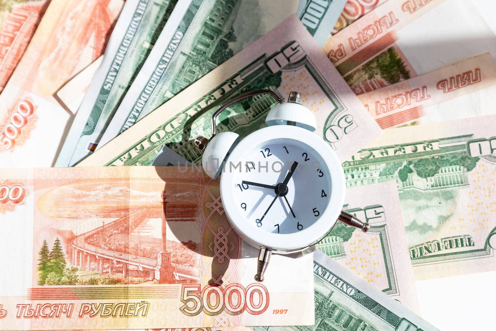 2022 money, economy and investment plan. new year economy crisis and change. money, alarm clock ,finance background.Bankruptcy and debt. Pay for debt. Bank collector service. by YuliaYaspe1979
