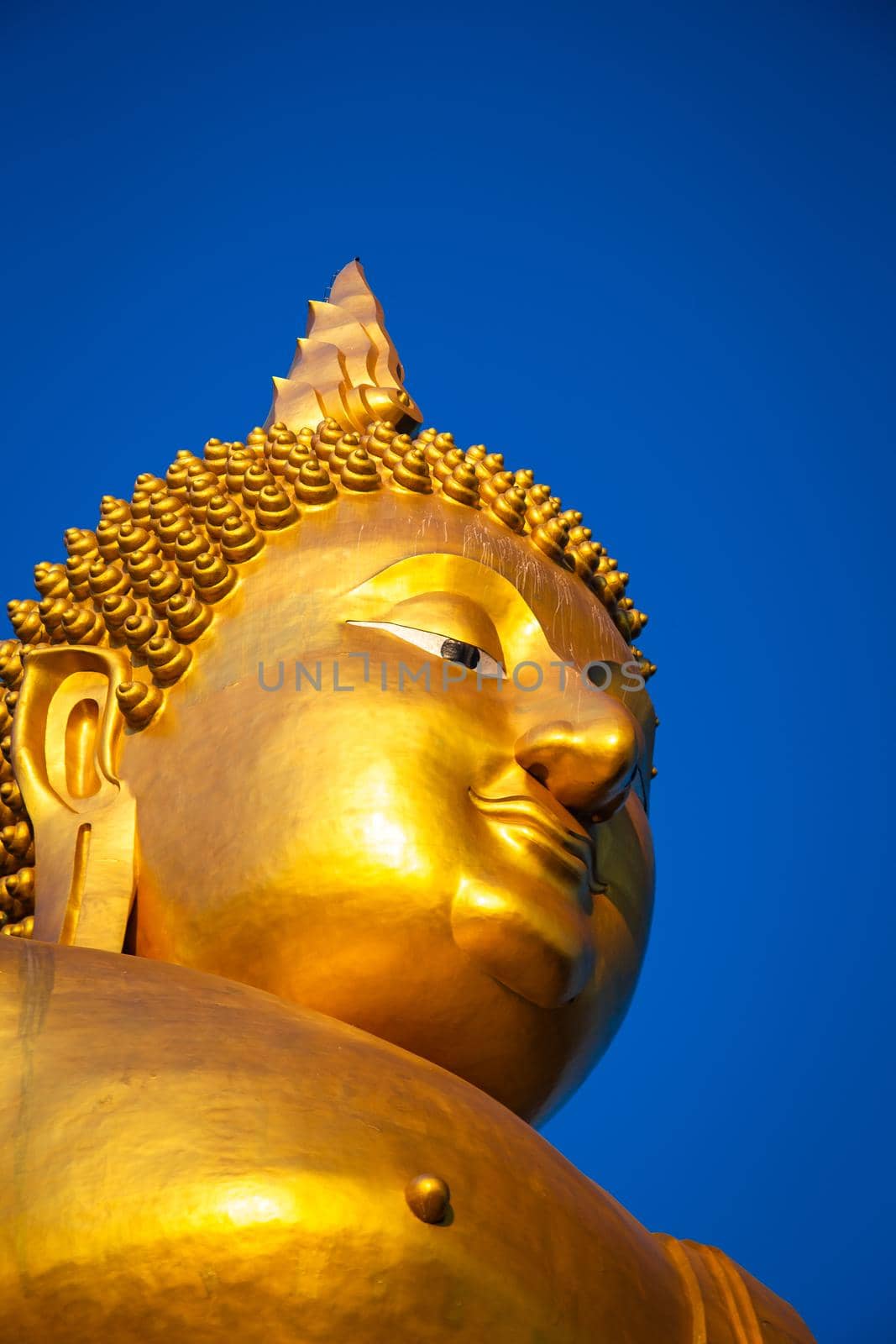 Big Buddha during sunset at Wat Muang in Ang Thong, Thailand, south east asia