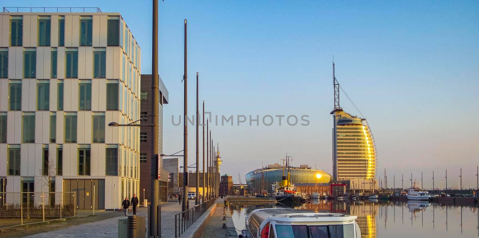 Cityscape sunset coast boats and dike panorama Bremerhaven Germany. by Arkadij