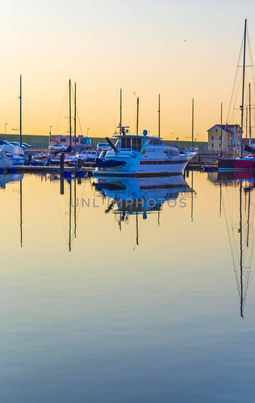 Cityscape sunset coast boats and dike panorama Bremerhaven Germany. by Arkadij