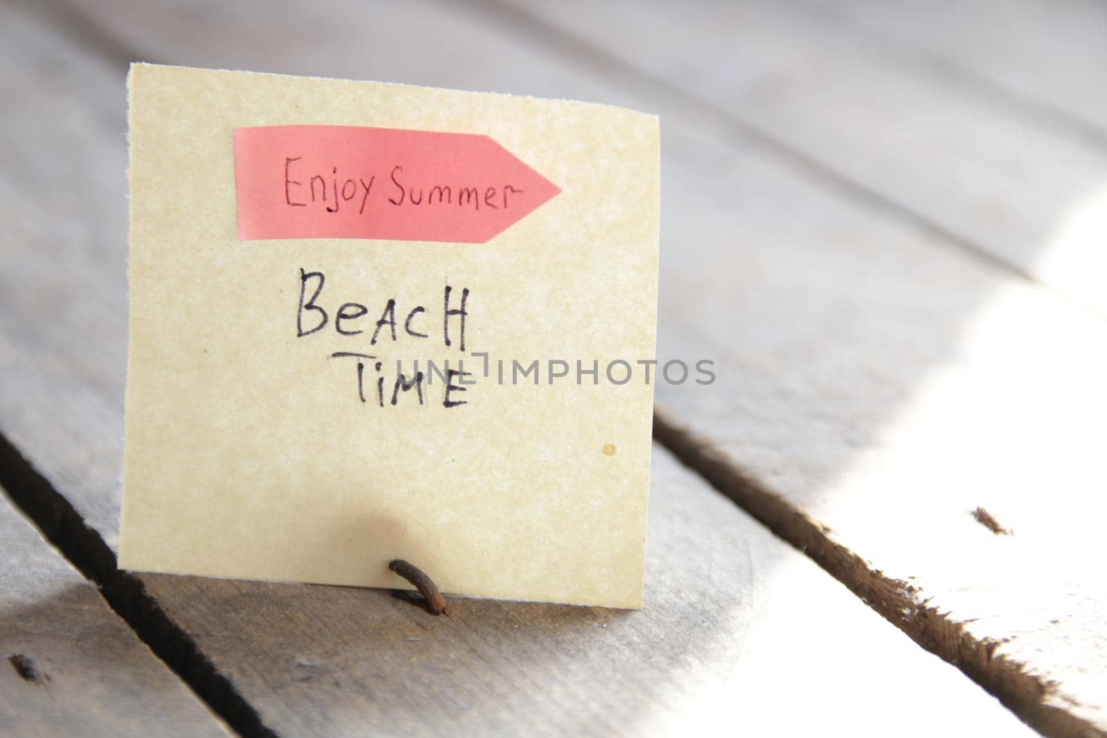 Sign with the inscription beach time. Summer travel idea. by Markgraf