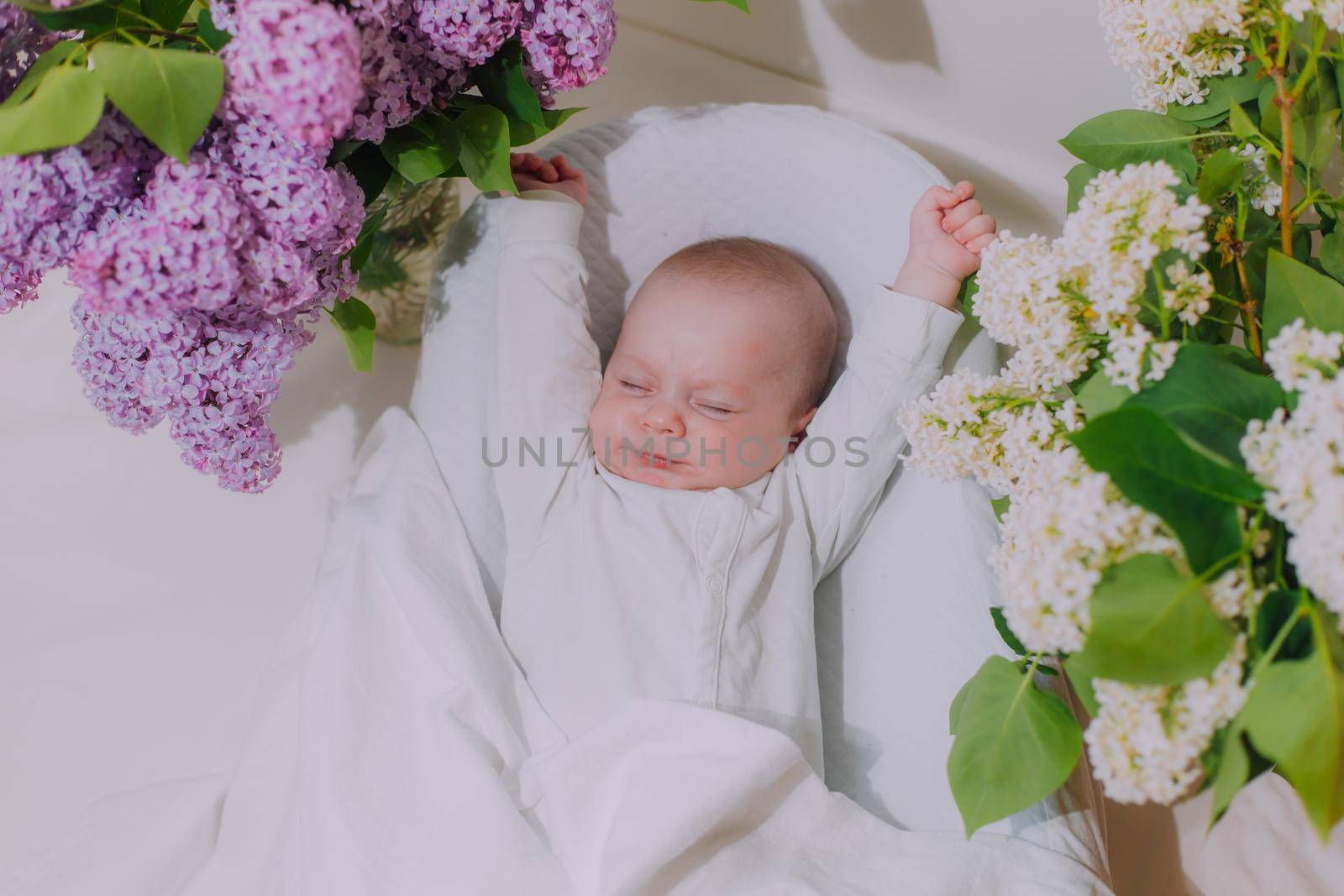 The baby stretches after sleeping Lifestyle . A happy child. Children's article. by alenka2194