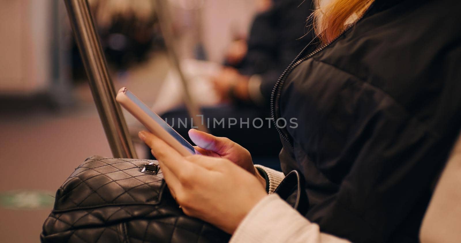 Passenger using technology phone in subway for travel. Means of communication. Lifestyle and transportation. Internet user.