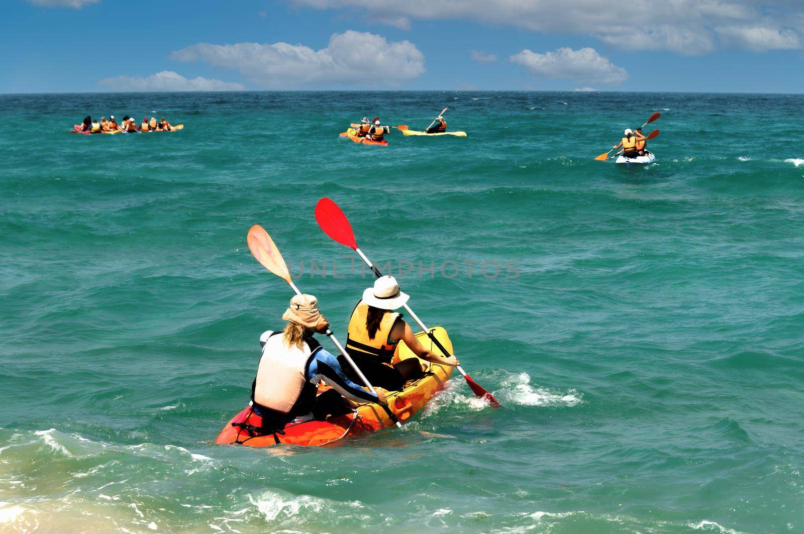 Kayak lovers gathered on Sunday in a large group to go kayaking in the warm sea