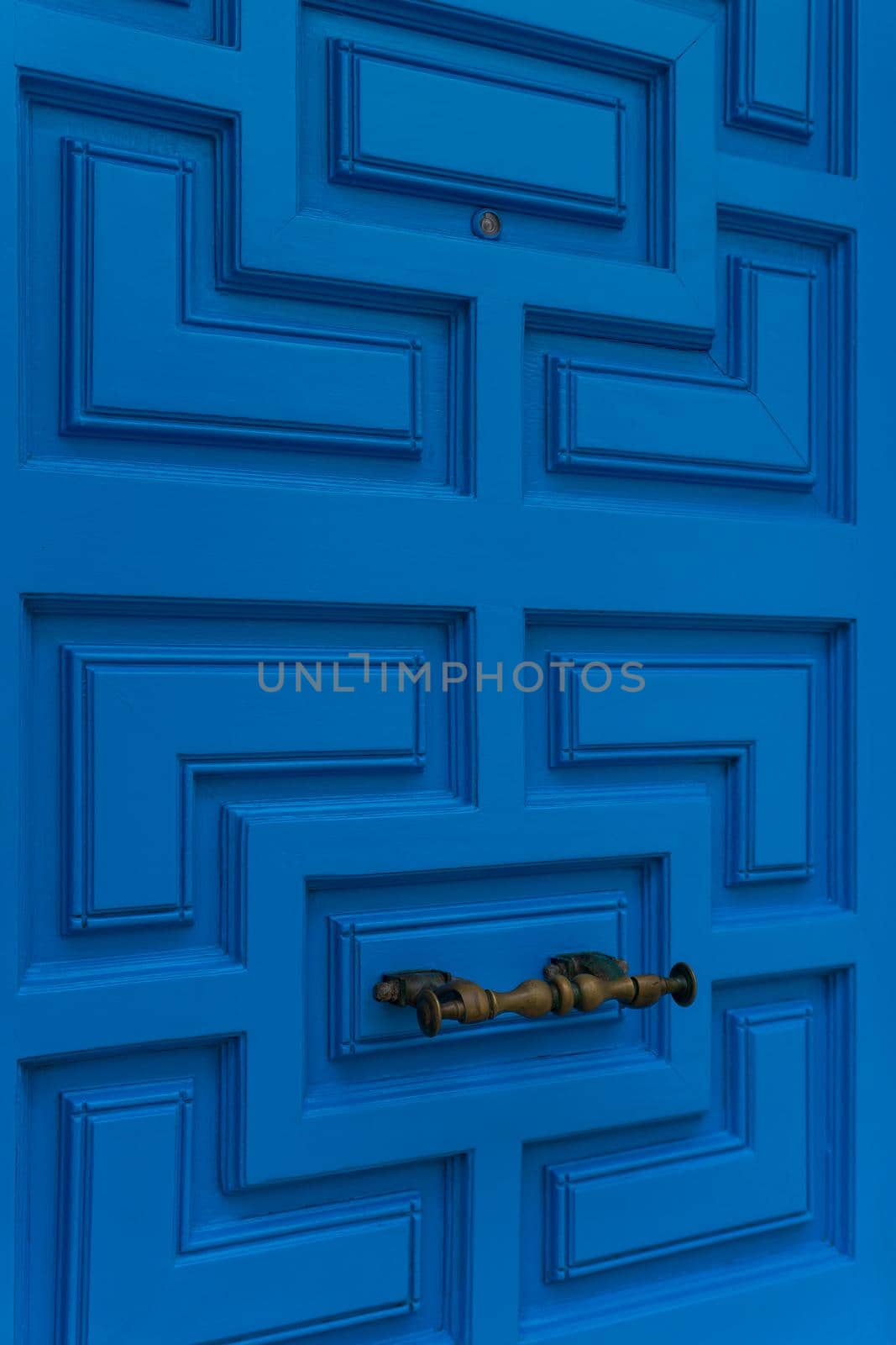 New closed modern bright blue door close up