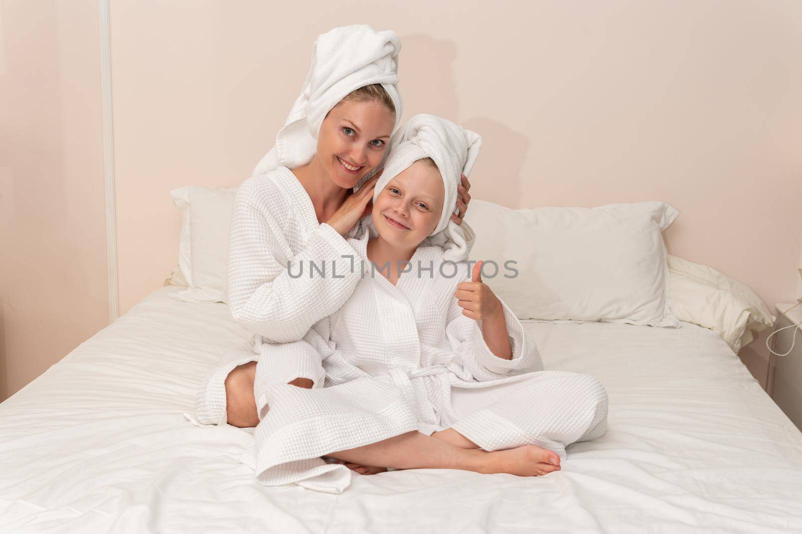 Daughter dries love mom bath smiling thinks elbows smile copyspace, from portrait hygiene for lifestyle and happy beauty, pirate baby. Hair kid comfort,