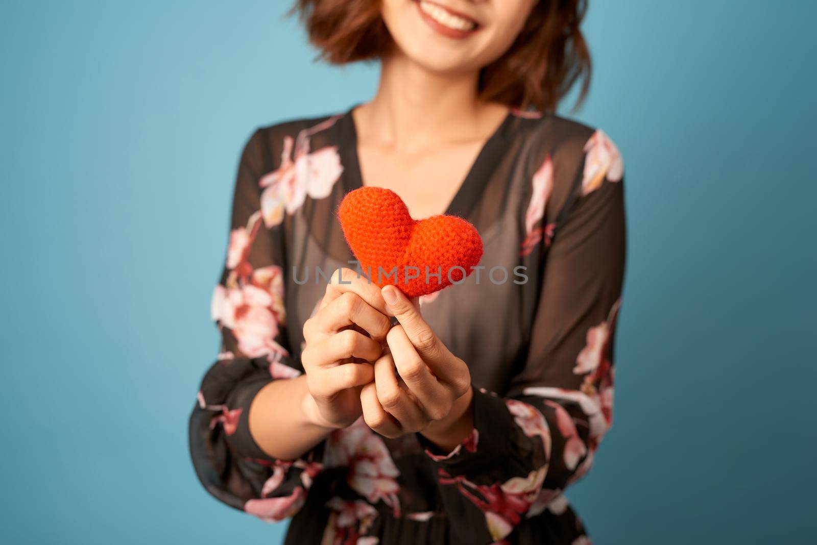 Valentines day woman holding a heart in front of her by makidotvn