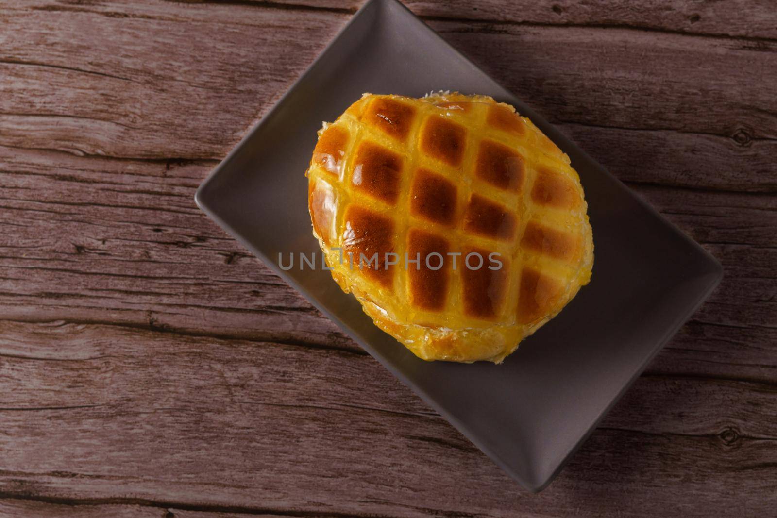 cream-filled bun covered with sugar syrup by joseantona