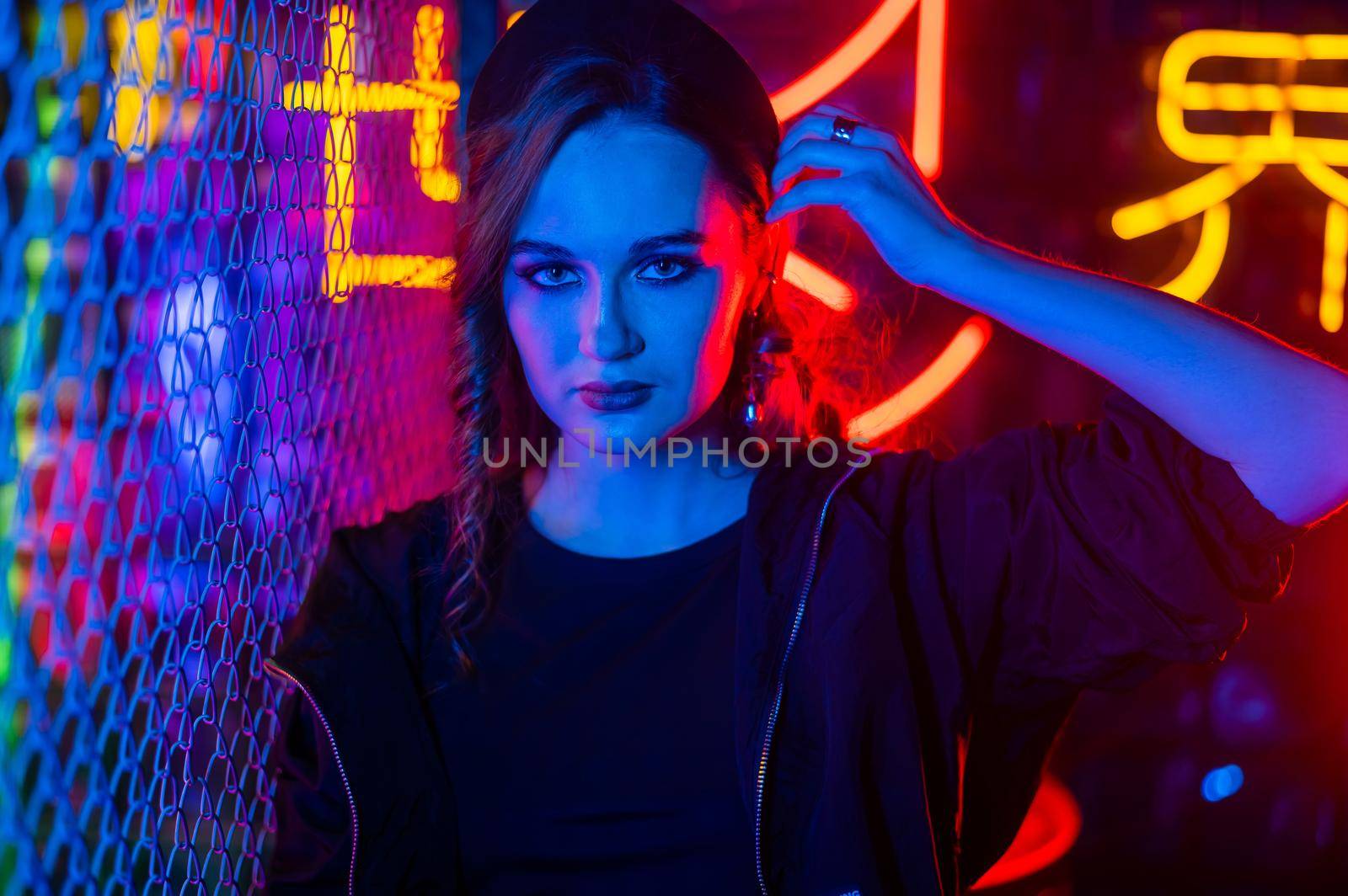 Caucasian woman posing in neon studio