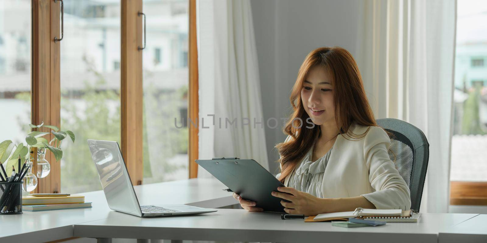 Business woman audit the company's financial results and budget.