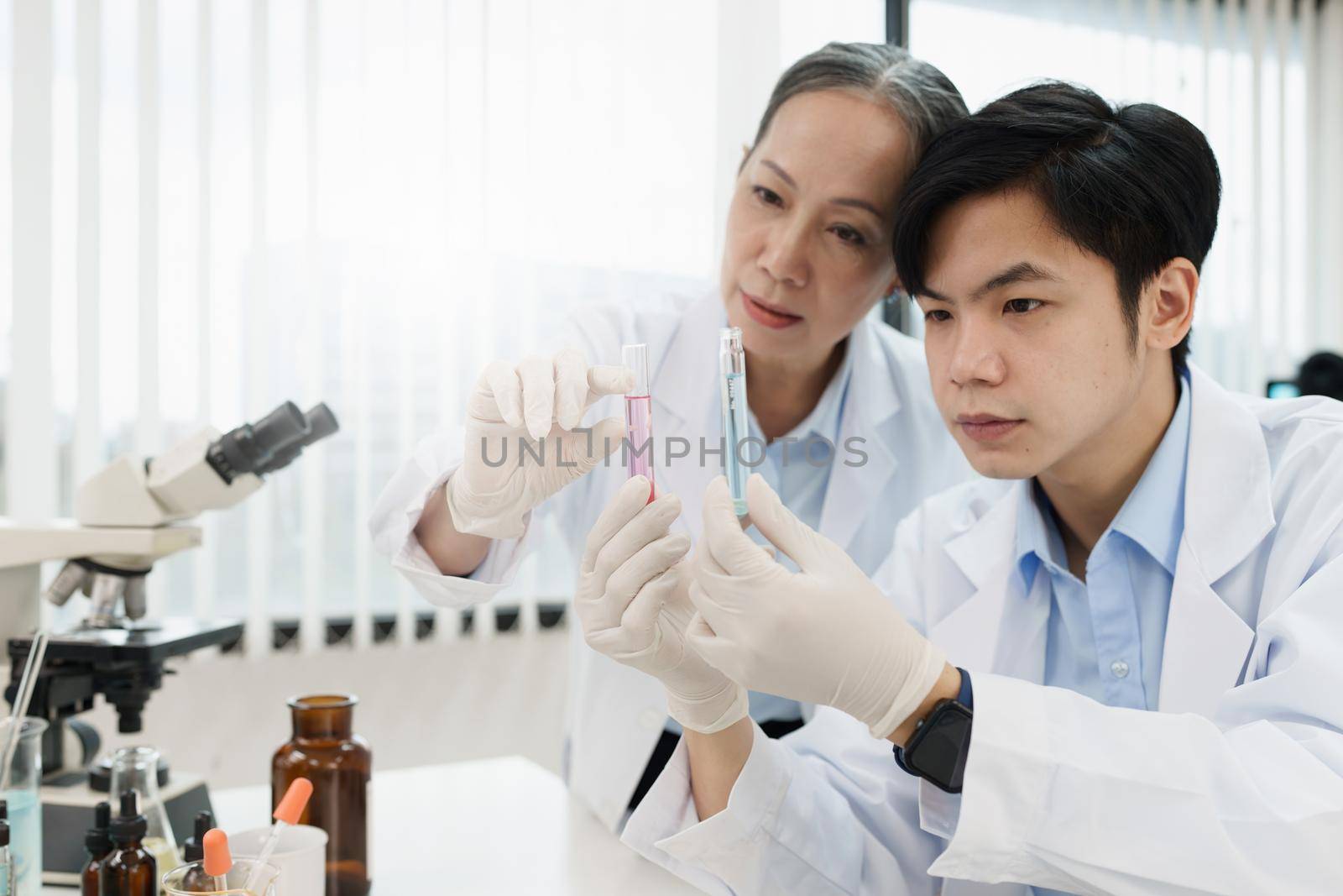 Health care researchers working in life of medical science laboratory by itchaznong
