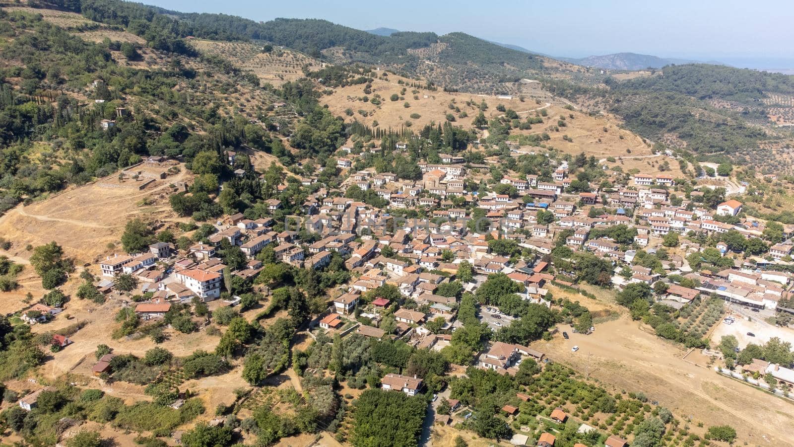 View of the old Sirince houses on the mountain slope. sirince is an old village of Selcuk, which is a district centre of Izmir. It is famous with its old Greek architecture and local wine. by senkaya