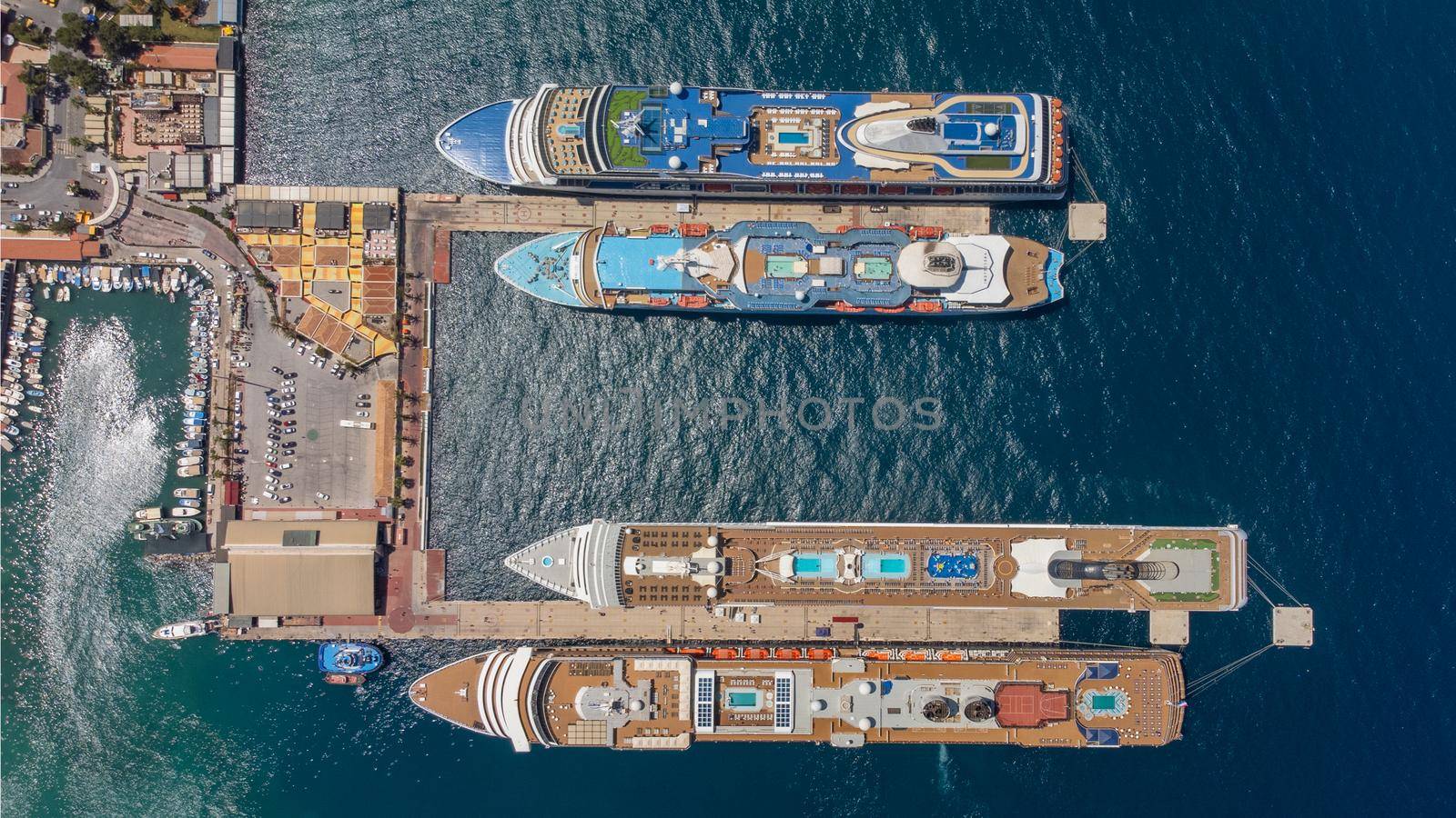 Aerial view of giant cruise ships moored in the port . High quality photo
