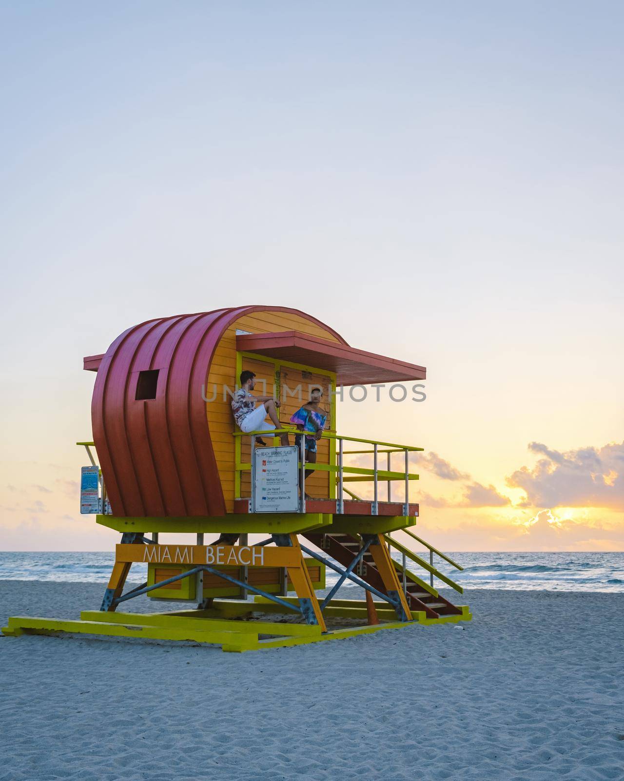 Miami beach, couple on the beach at Miami beach, life guard hut Miami beach Florida by fokkebok