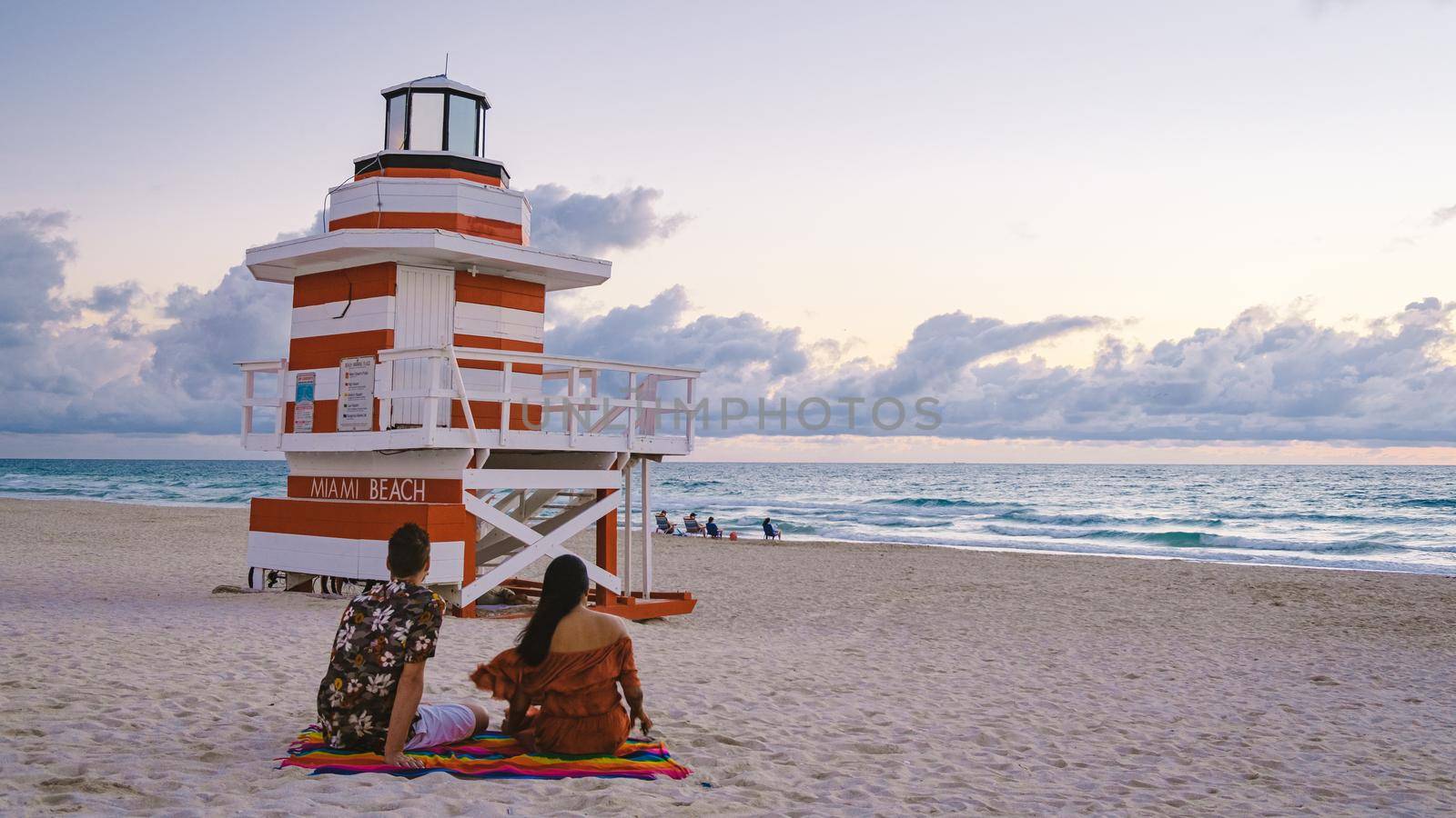 Miami beach, couple on the beach at Miami beach, life guard hut Miami beach Florida by fokkebok