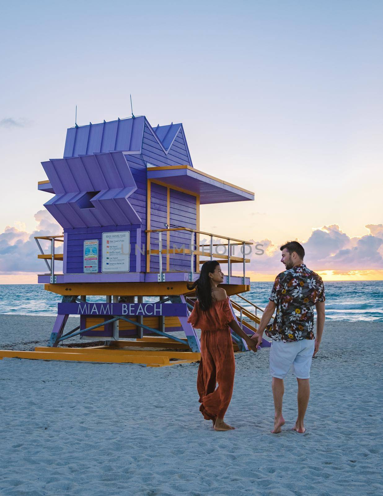 Miami beach, couple on the beach at Miami beach, life guard hut Miami beach Florida by fokkebok