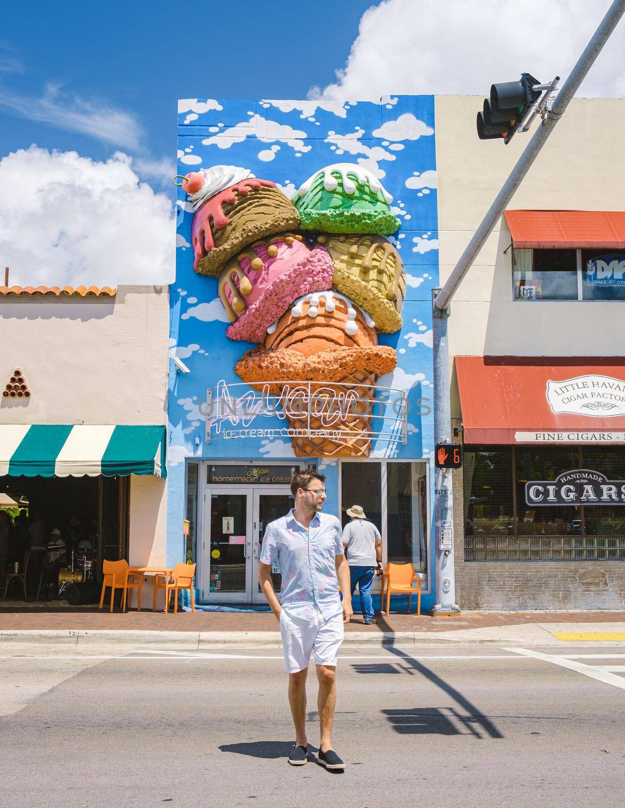 Little Havana Miami Florida April 2019, colorful Streets of Little Havana in Miami with art on the walls. men having a ice cream during summer