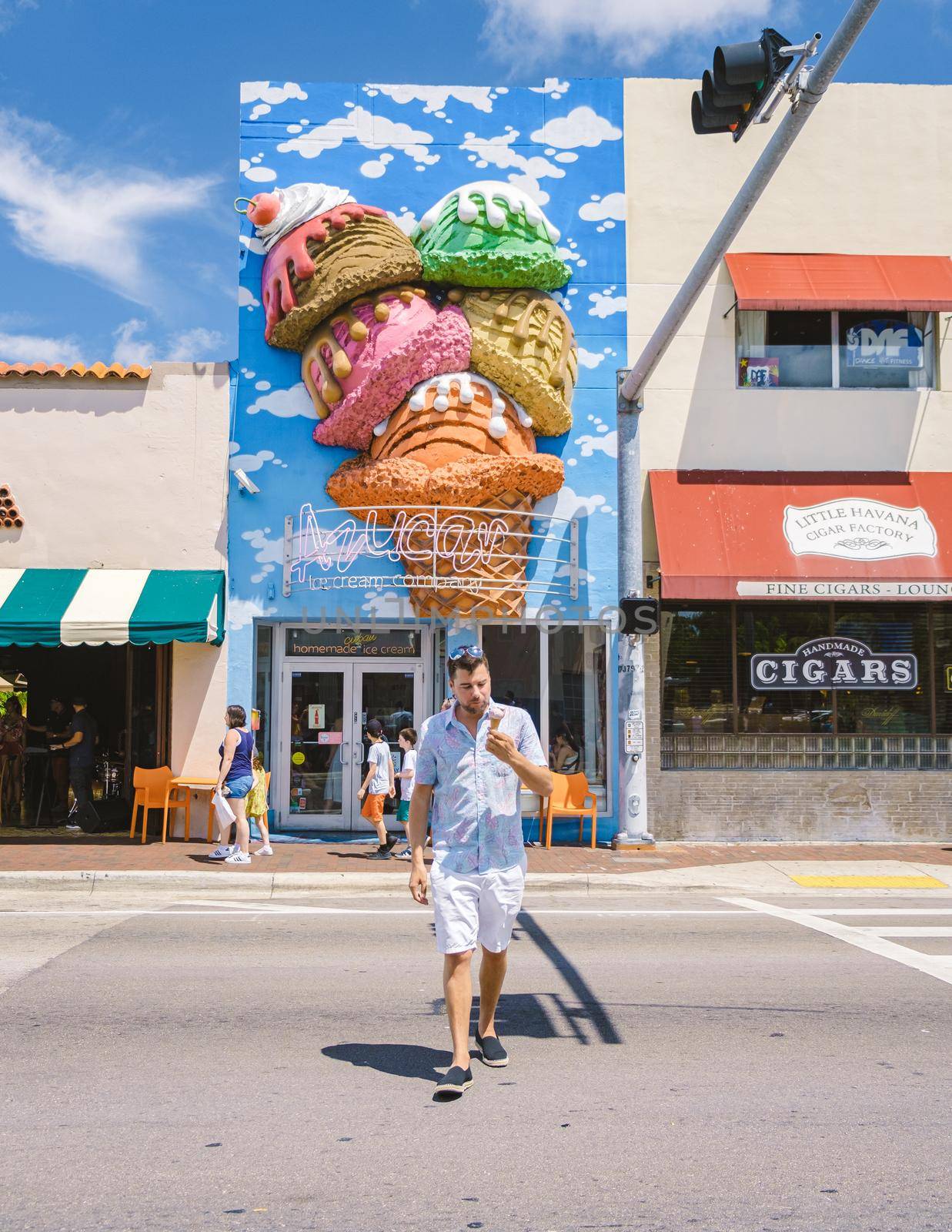 Little Havana Miami Florida April 2019, colorful Streets of Little Havana in Miami with art on the walls. men having a ice cream during summer