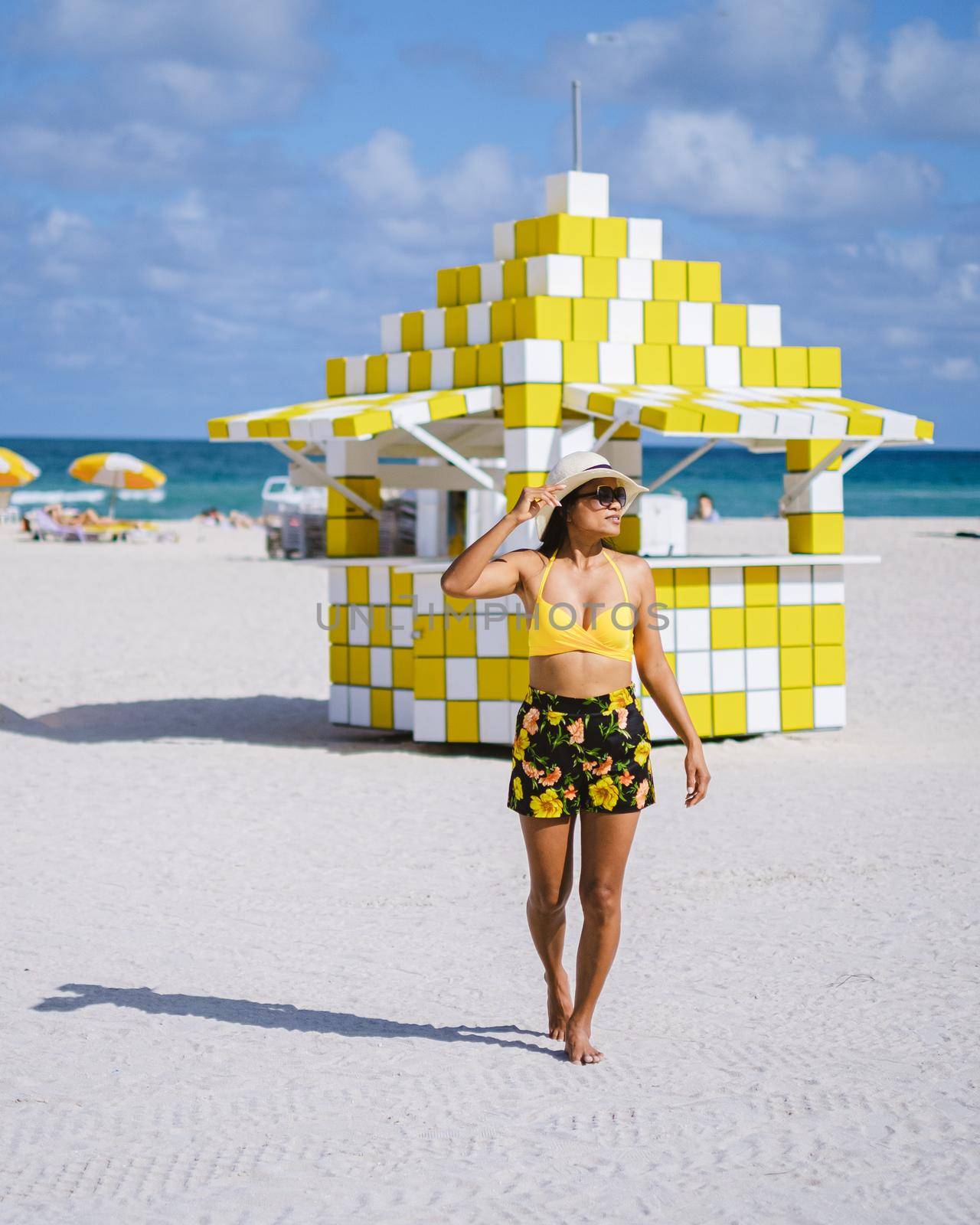 Miami beach, couple on the beach at Miami beach, life guard hut Miami beach Florida by fokkebok