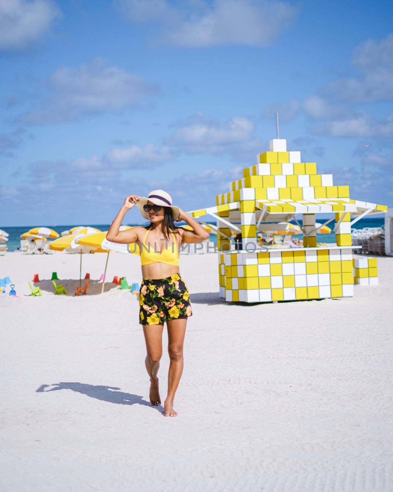 Miami beach, couple on the beach at Miami beach, life guard hut Miami beach Florida by fokkebok