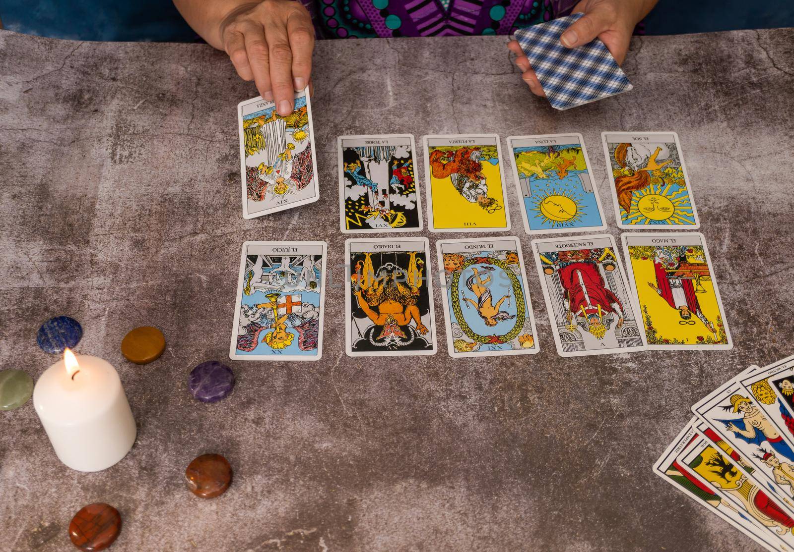 woman casting tarot cards by joseantona