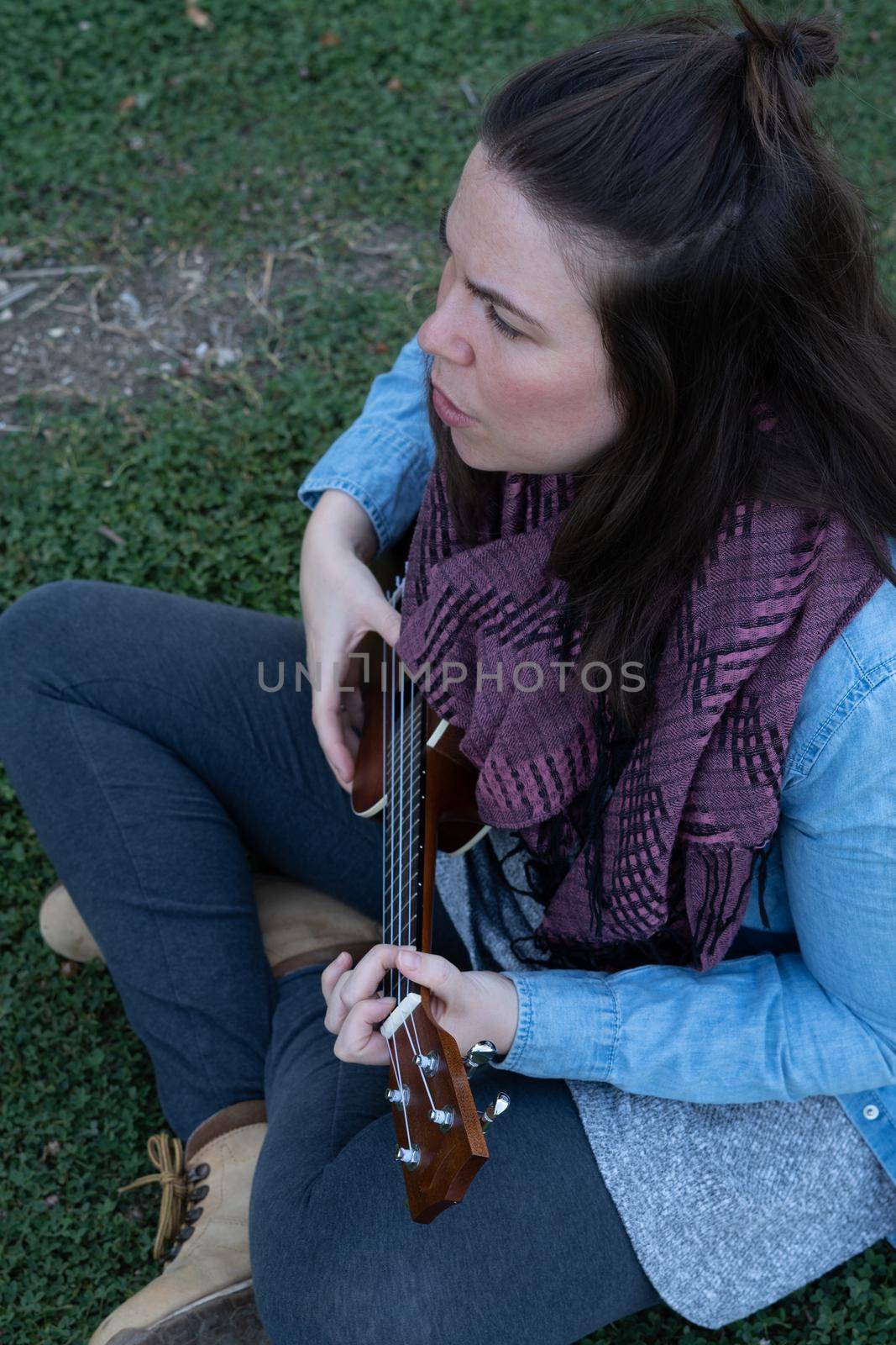 girl playing the ukulele by joseantona