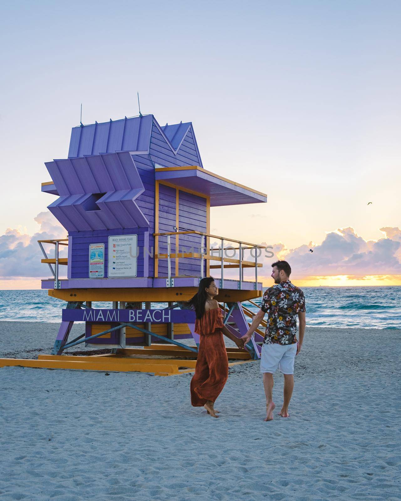 Miami beach, couple on the beach at Miami beach, life guard hut Miami beach Florida by fokkebok