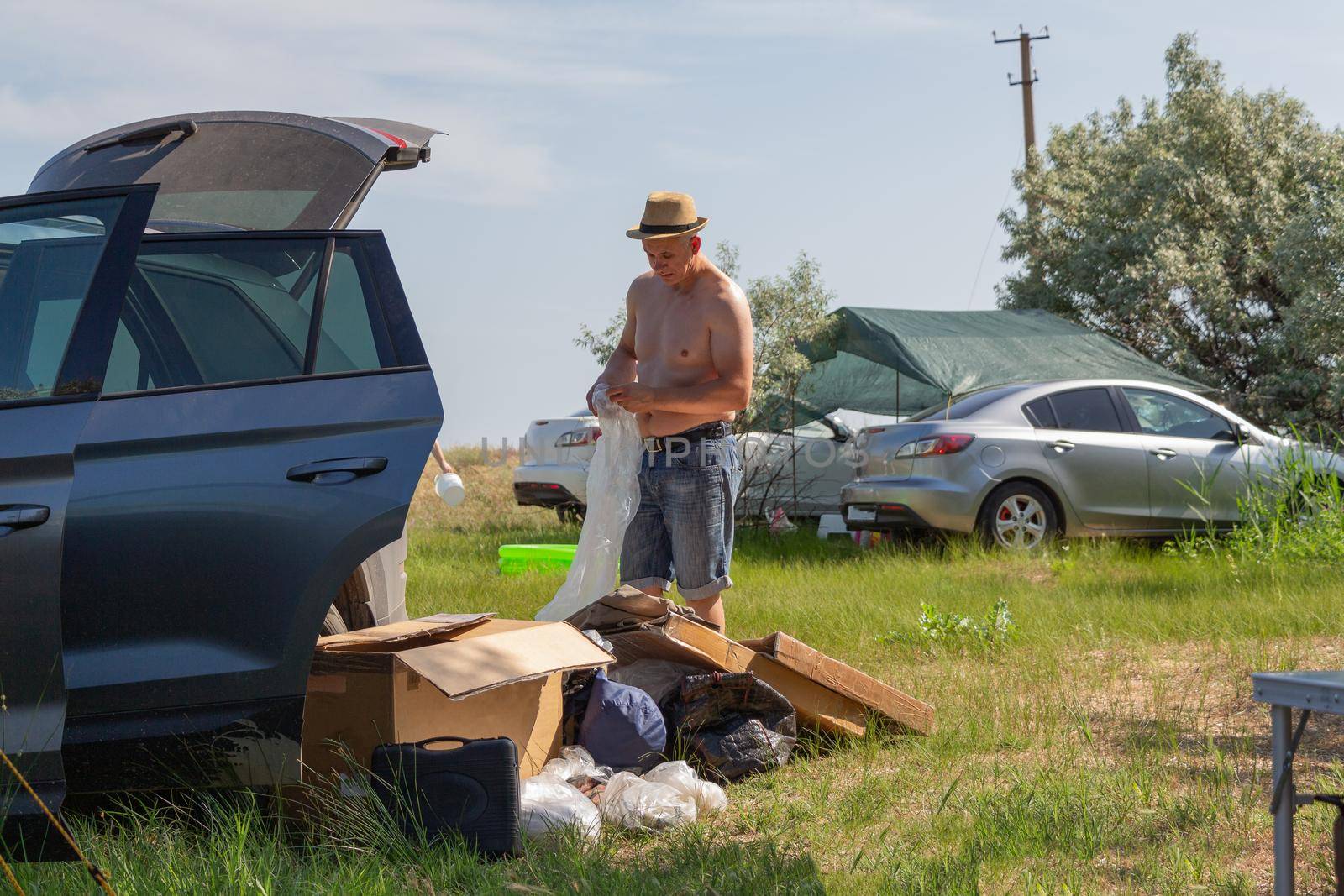 Travelling by car. Family summer vacation in nature. Camping in the forest or at sea.