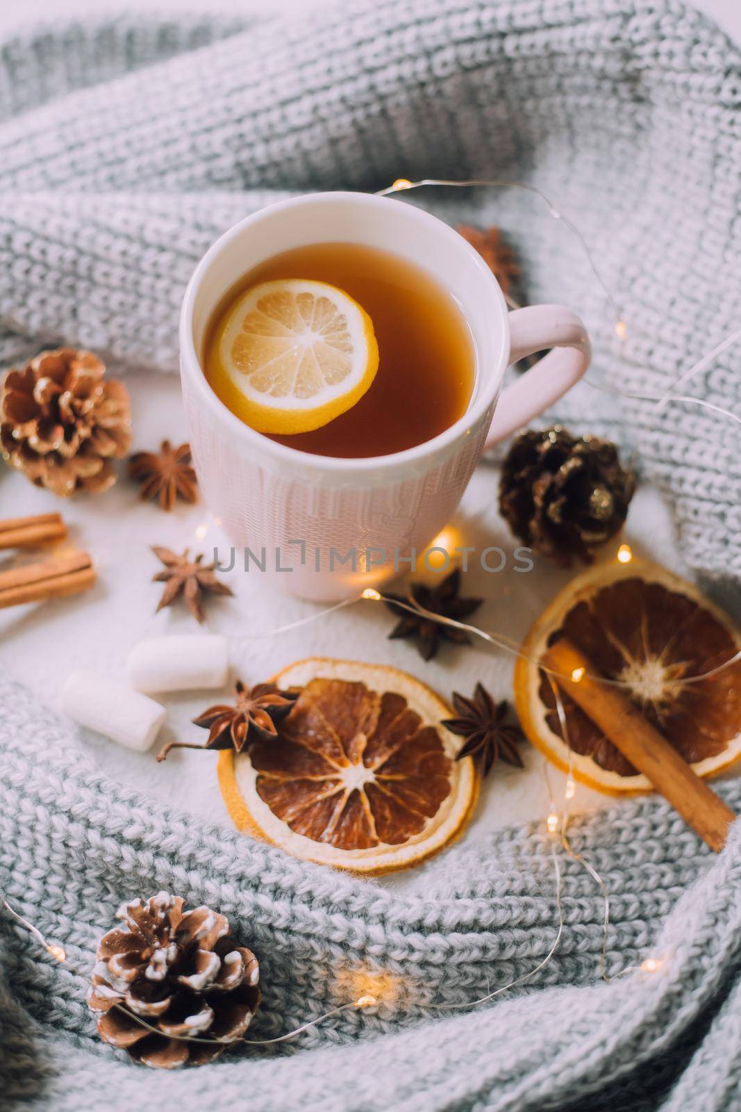 New Year's tea with a garland and oranges . Christmas mood. A cold evening. Hot drinks. by alenka2194