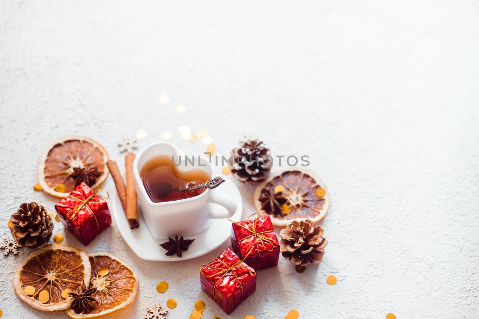 New Year 's tea on a white background . Glitter and white background. Holiday. Holiday decorations. Hot tea . The layout is a festive tea party. Christmas