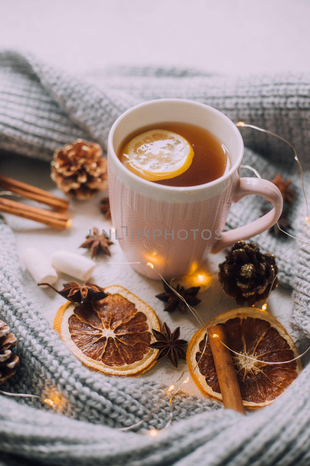 New Year's tea with a garland and oranges . Christmas mood. A cold evening. Hot drinks. by alenka2194
