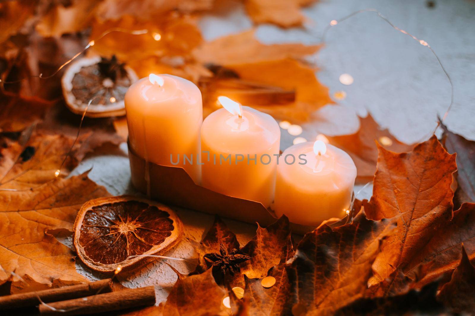 Autumn leaves and candles . cozy vibes. Autumn article. Printed products autumn.