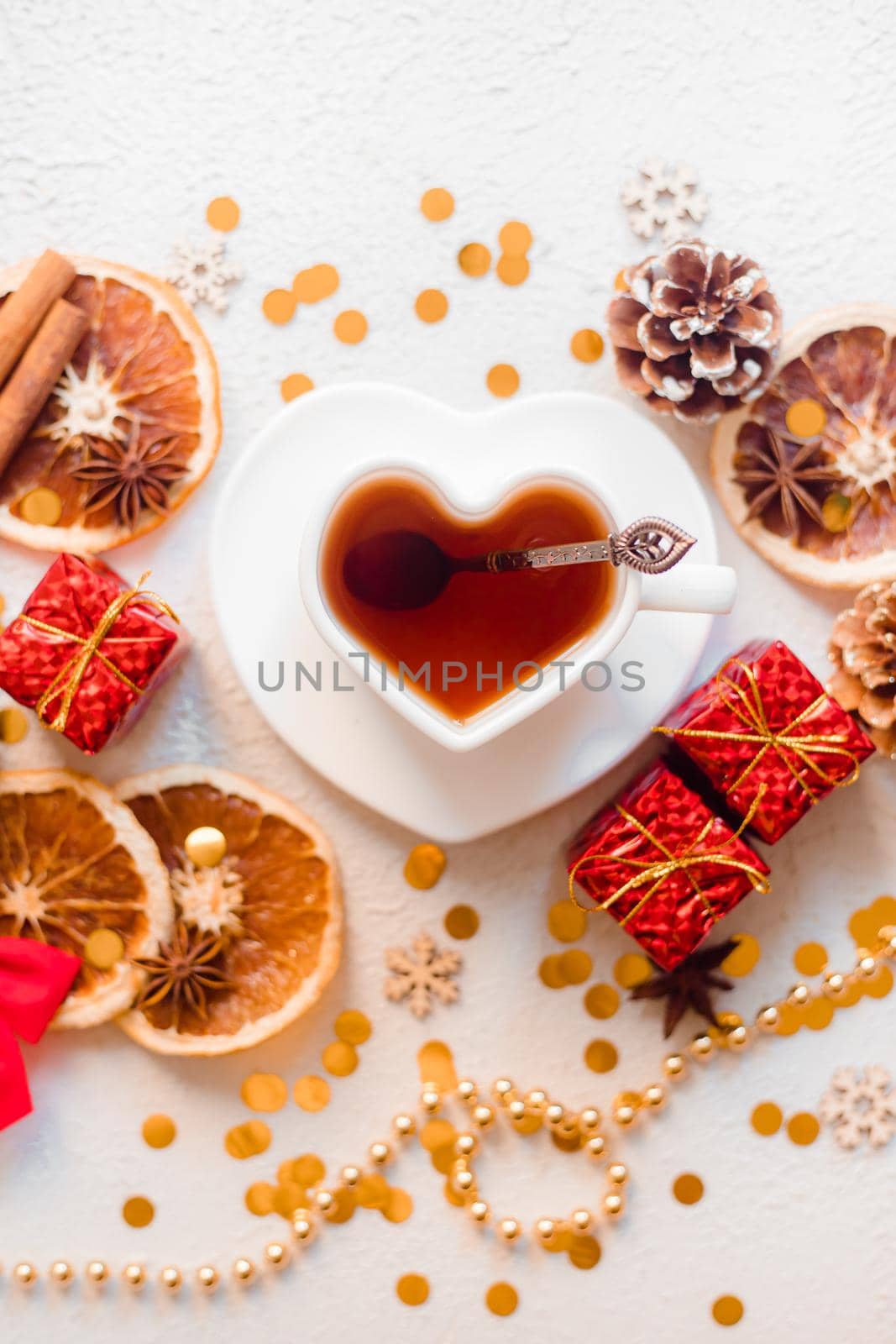 New Year 's tea on a white background . Glitter and white background. Holiday. Holiday decorations. Hot tea . The layout is a festive tea party. Christmas