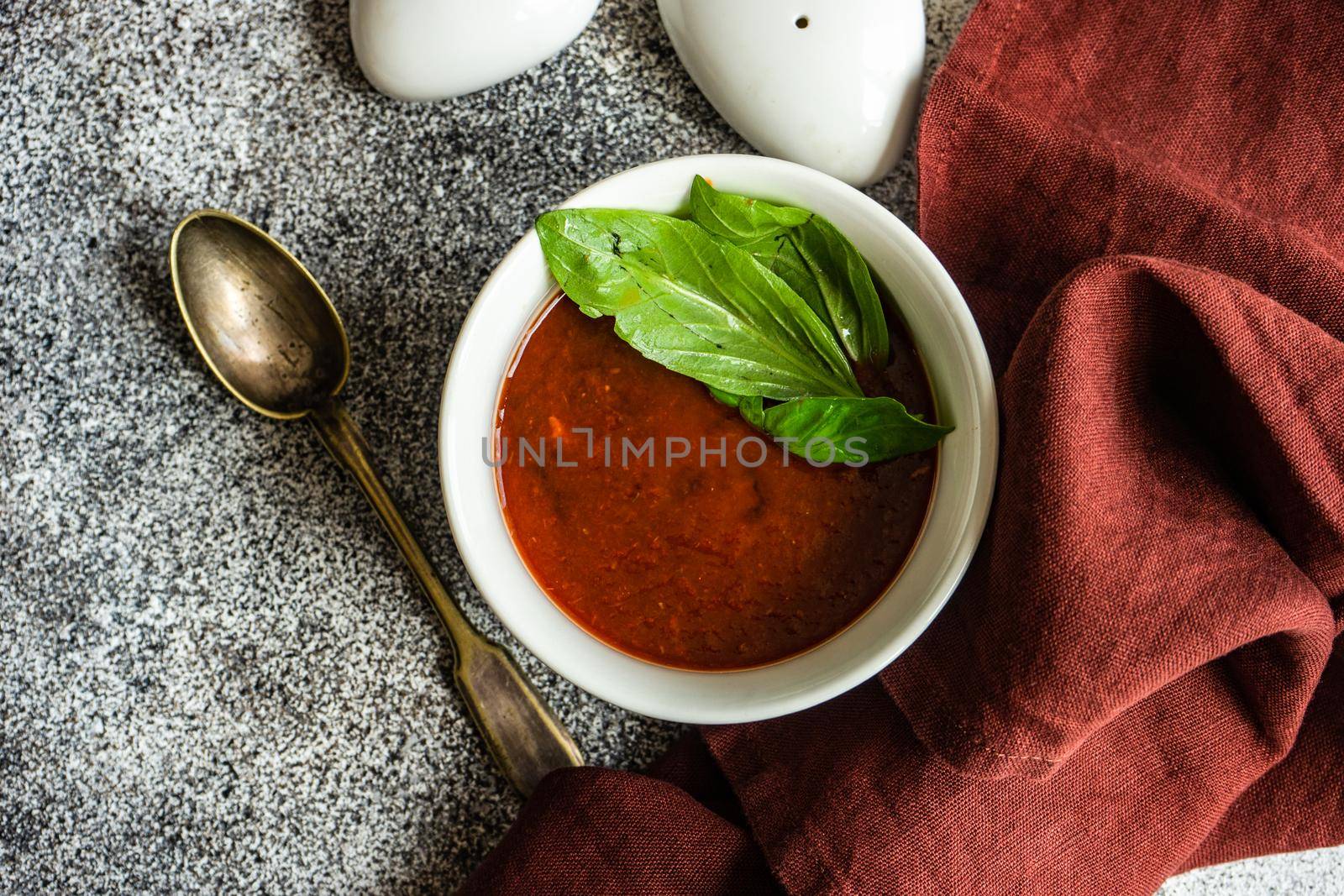 Served spanish gazpacho soup on rustic background with copy space