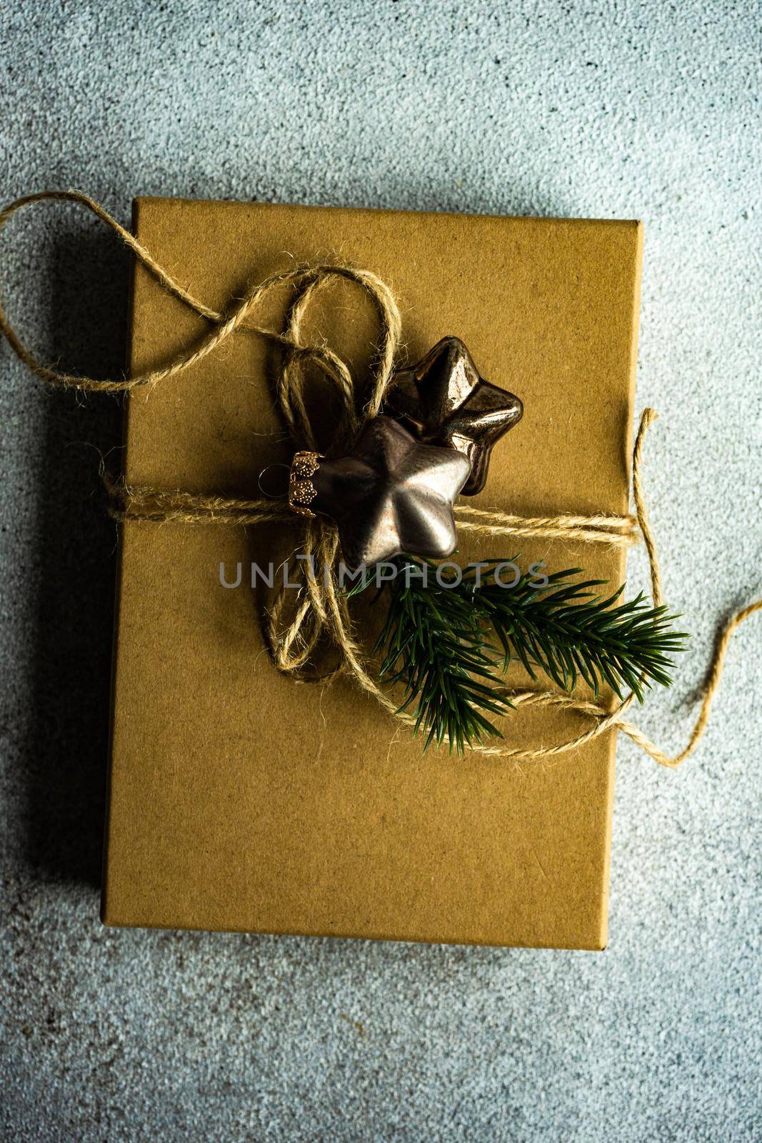 Christmas holiday gift box wrapping concept on concrete background