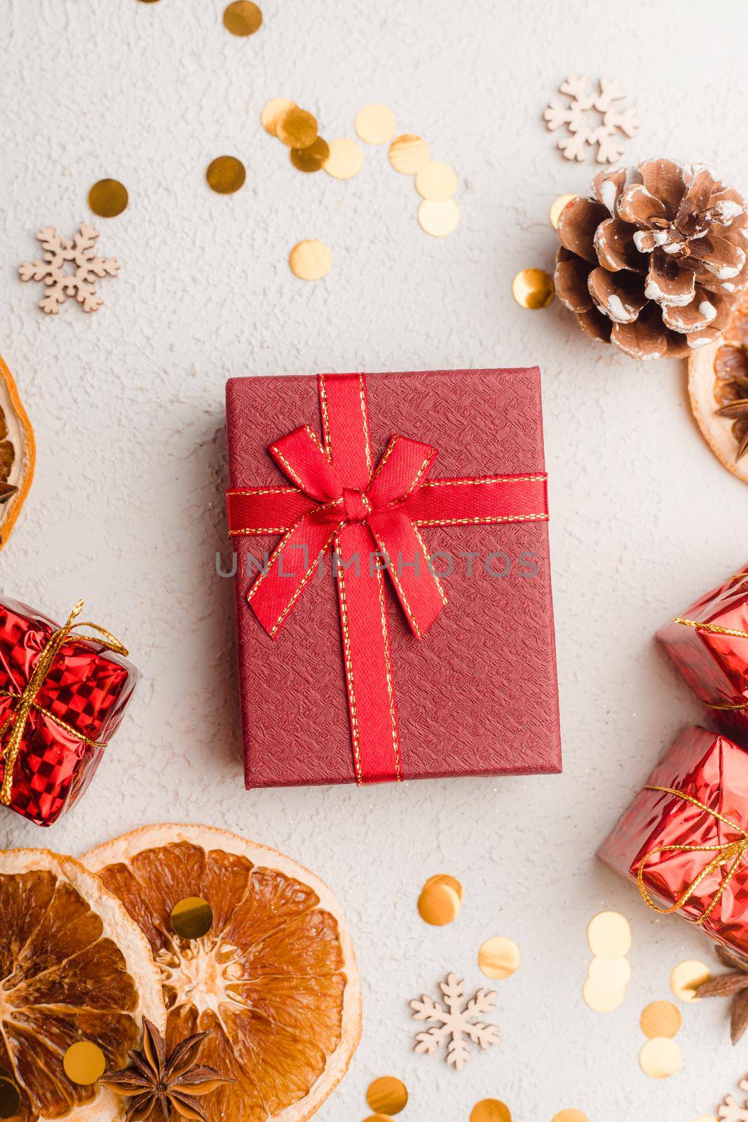 New Year's gift layout on a white background. An article about choosing a gift for a holiday. Red gift wrapping. New Year and Christmas