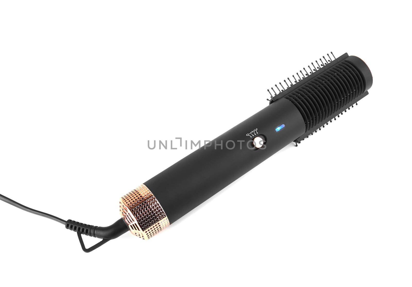 Modern hair dryer with comb brushing isolated on white background