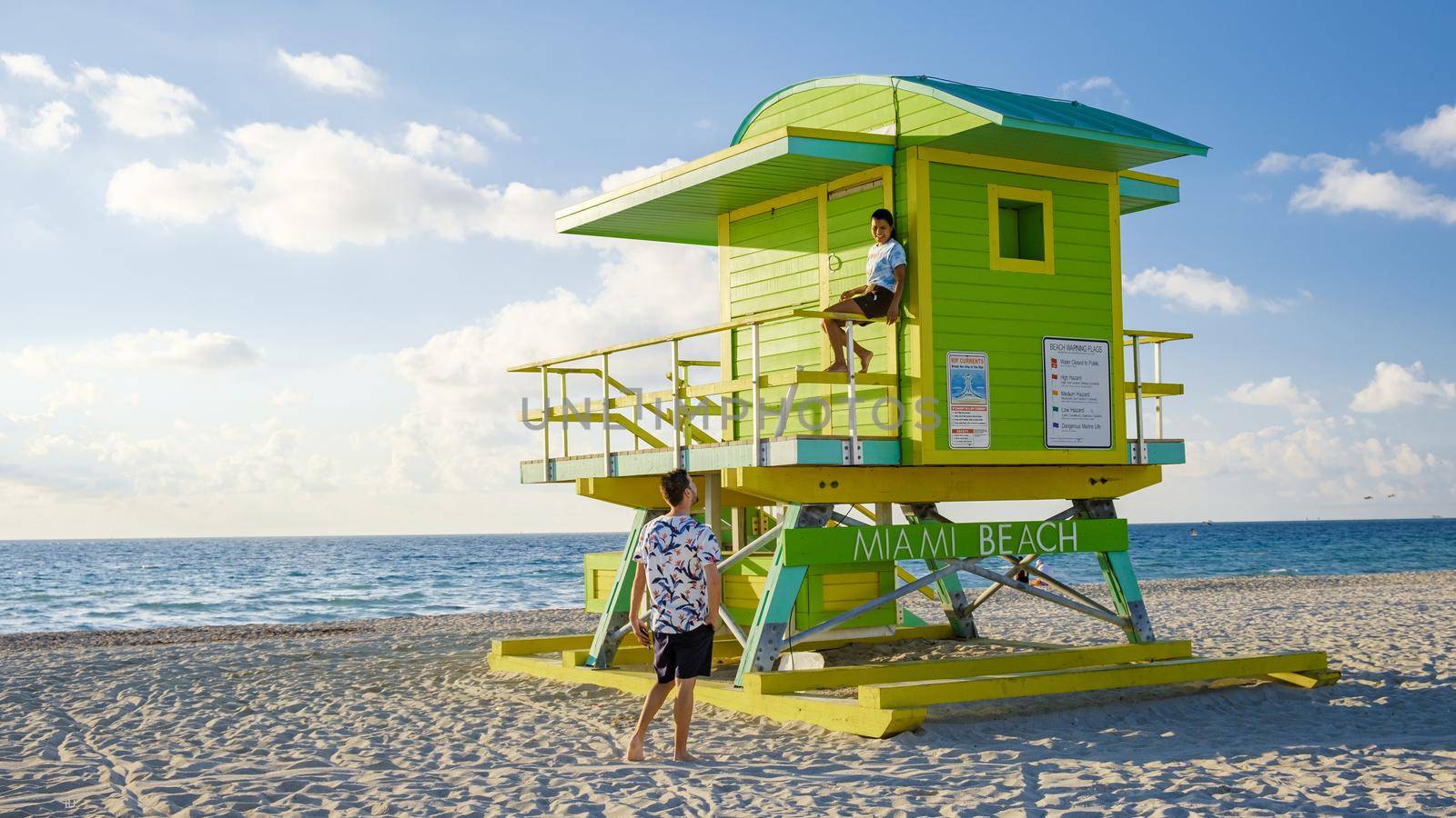 Miami beach, couple on the beach at Miami beach, life guard hut Miami beach Florida by fokkebok