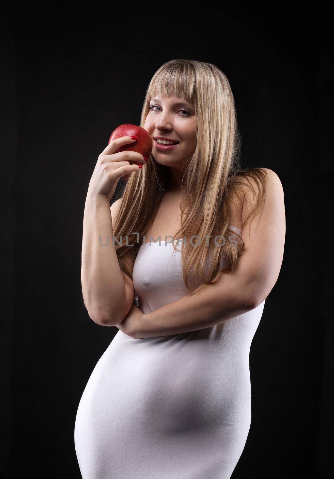 Young woman in mermaid costume with apple by rivertime