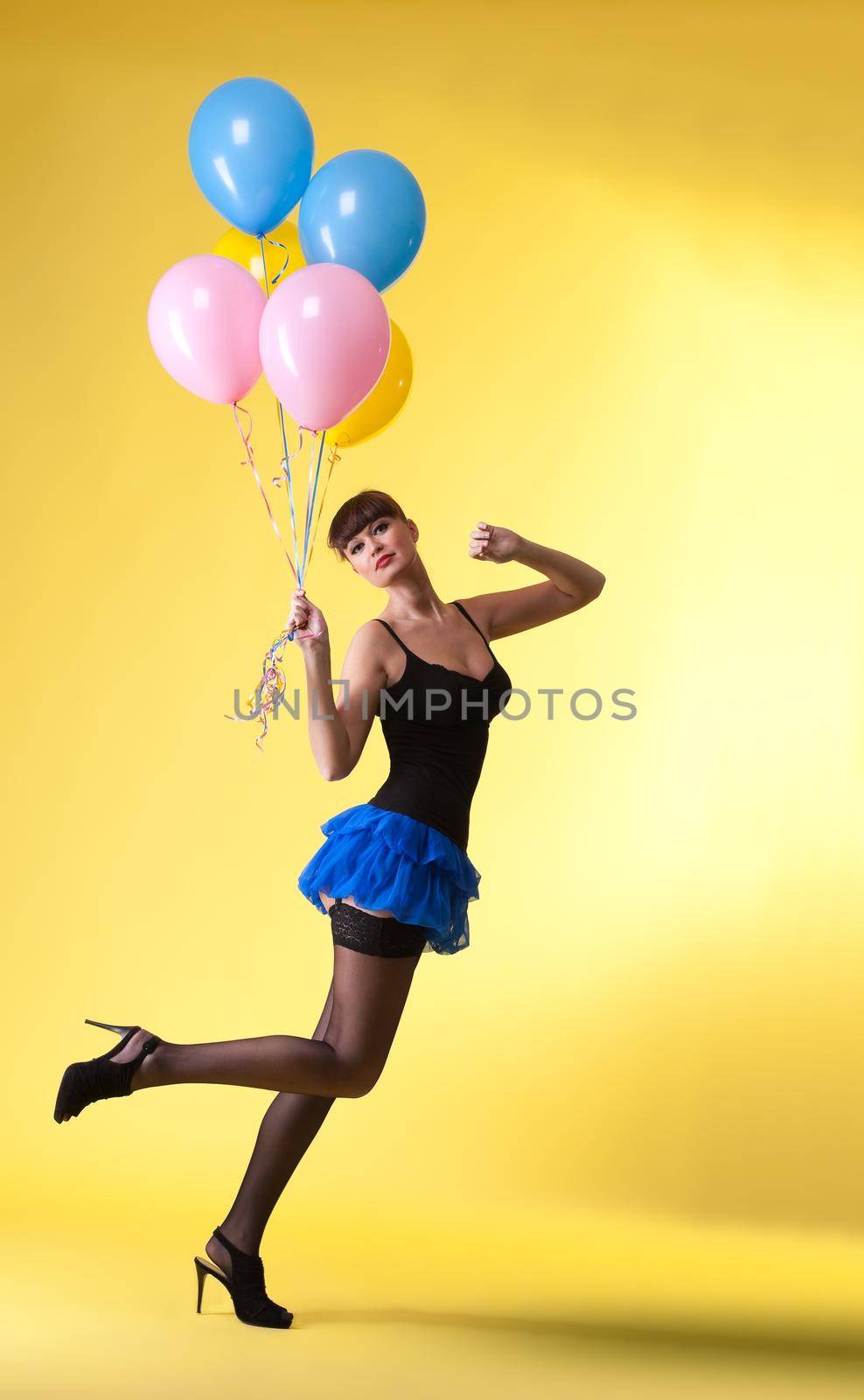 pretty woman with balloons pinup style on yellow