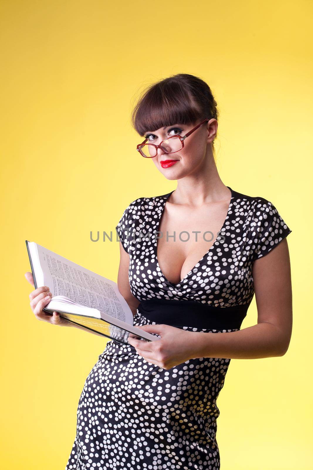 Beauty woman in attractive dress and glasses read smart book