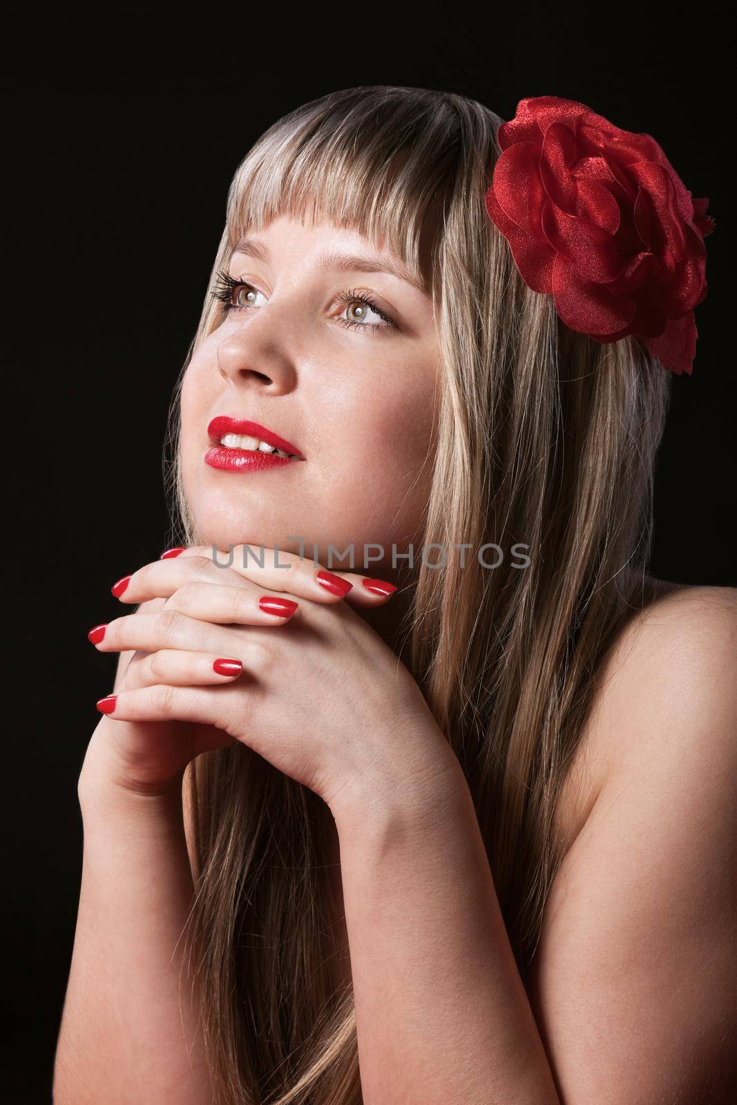 Happy Blond Girl With Red Flower in hair look at light