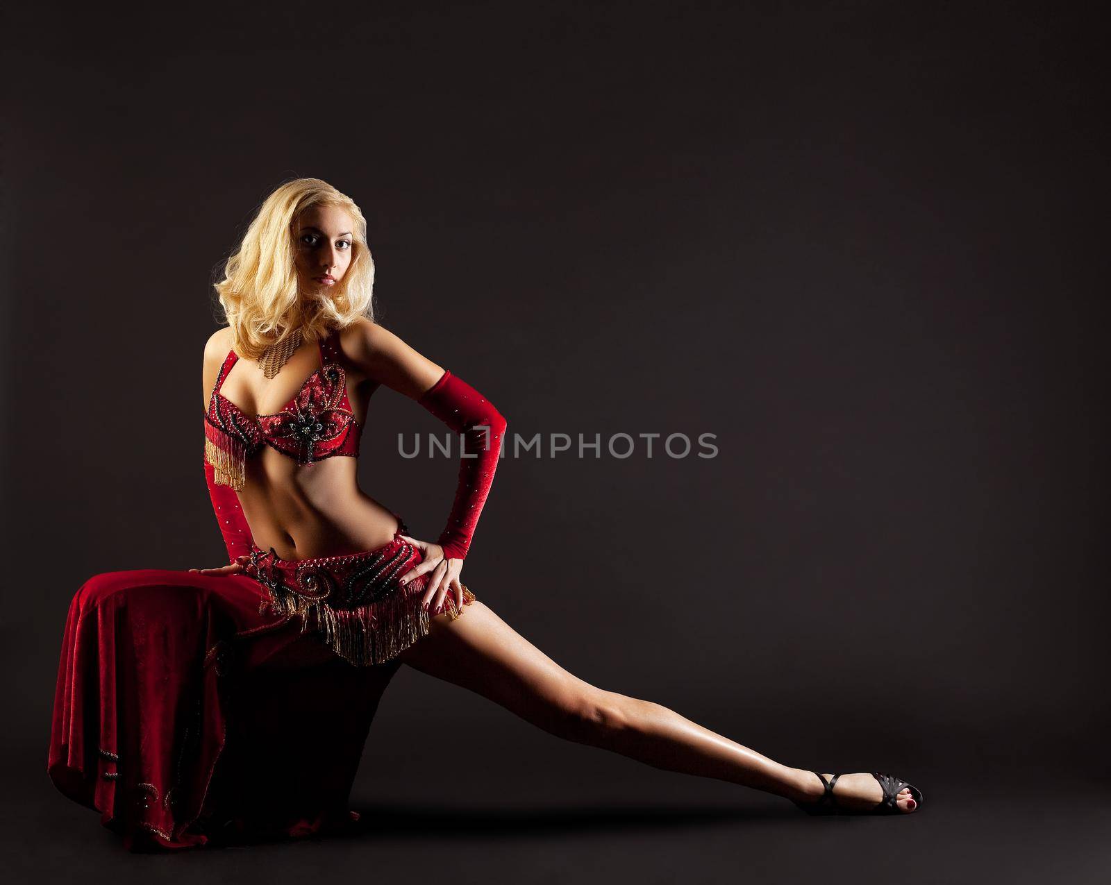 Young blond girl in dance - red arabian costume by rivertime